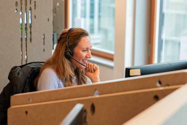 Strahlende Gesichter im Callcenter der Aduno Gruppe in Zürich-Oerlikon.